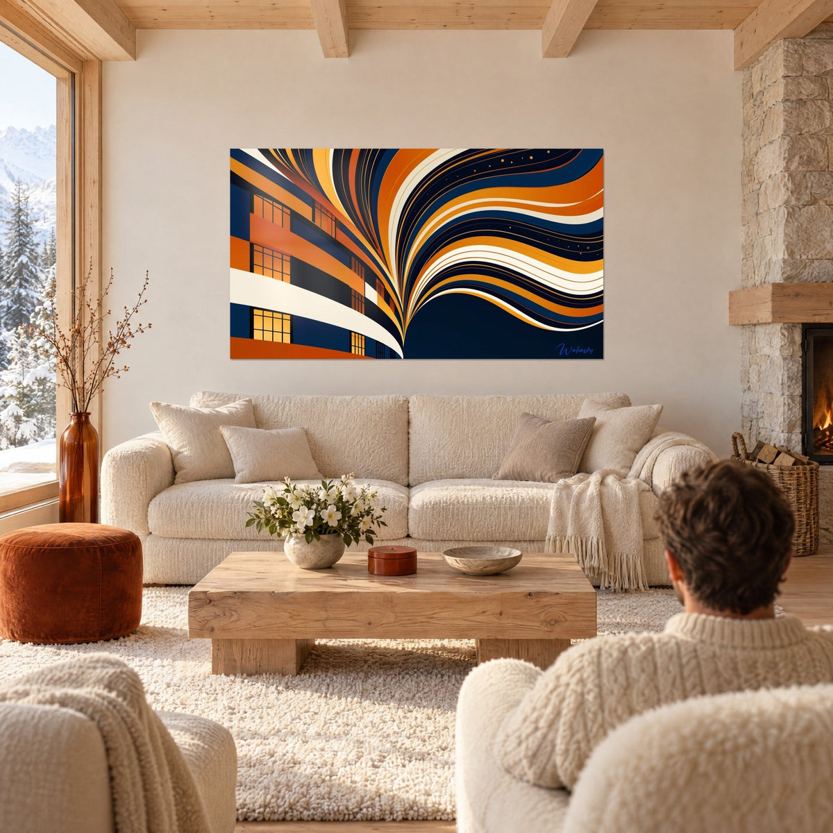 Tableau façade vitrée aux fenêtres ambrées, rubans orange et crème en gerbe sur fond marine, au-dessus d'un canapé dans un salon lumineux