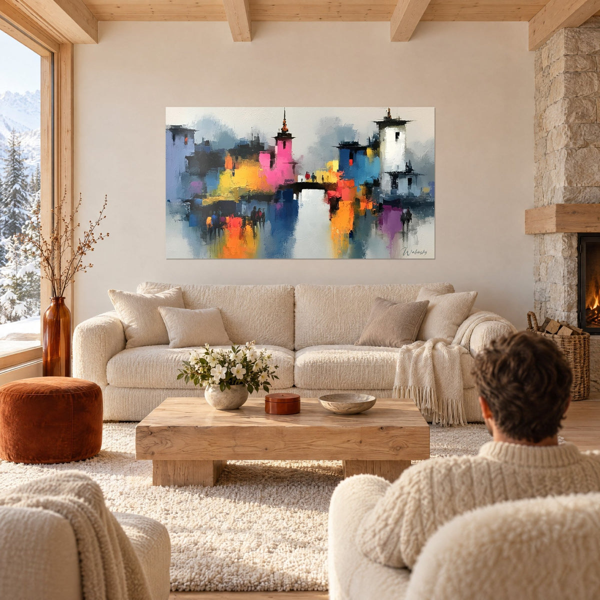Tableau cité abstraite aux tours roses et blanches, reflets orange sur l'eau, au-dessus d'un canapé dans un salon lumineux