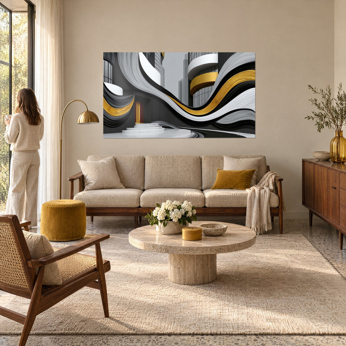 Wall art with a wavy black and gold ribbon between glass towers, red door, white staircase, woman seen from behind, above a sofa in a bright living room