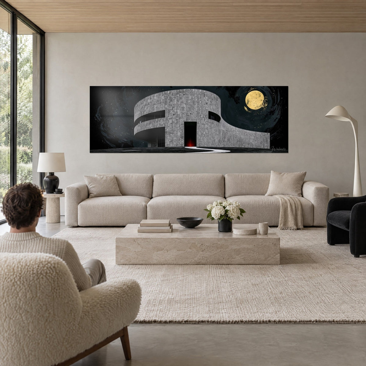 Cuadro edificio circular de piedra gris bajo una luna dorada, cielo negro arremolinado, encima de un sofá en un salón luminoso