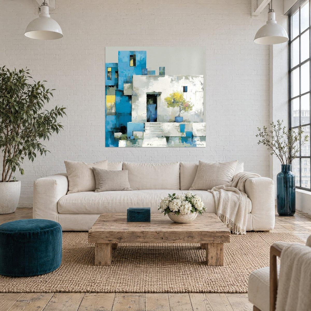 Cuadro de una casa cicládica con postigos azules y paredes blancas, limonero amarillo en una maceta azul cobalto, sobre un sofá en un salón luminoso