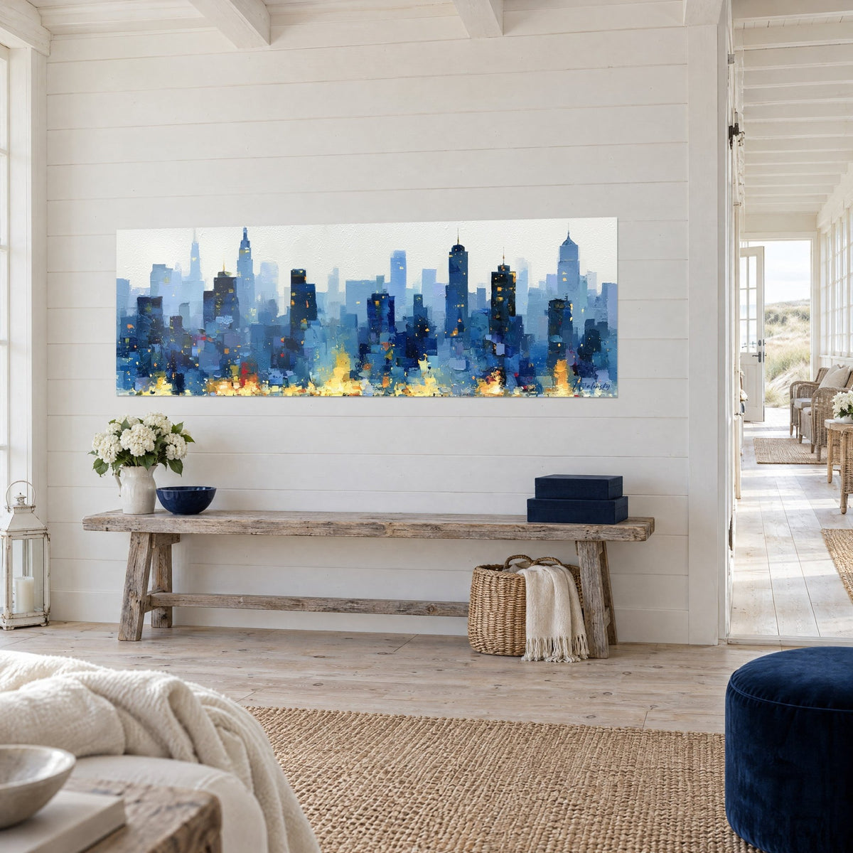 Tableau panorama de tours estompées en bleu cobalt et gris perle, lueurs jaunes en bas, sur un mur planche blanc