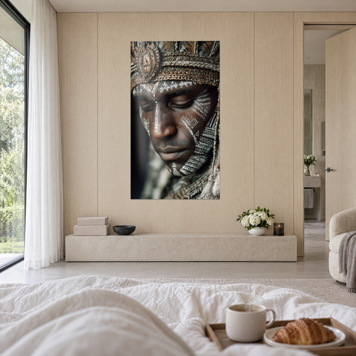 Wall art of a serene painted face, white lines on brown skin and ochre beads, above a bed in a light bedroom