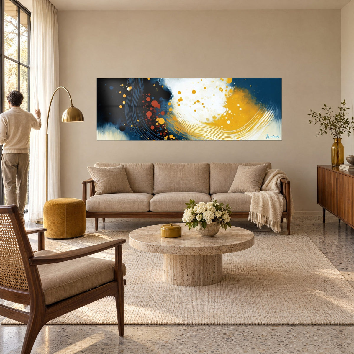 Wall art swirl of ochre and white outlined in navy blue, rust-colored splashes, above a sofa in a bright living room