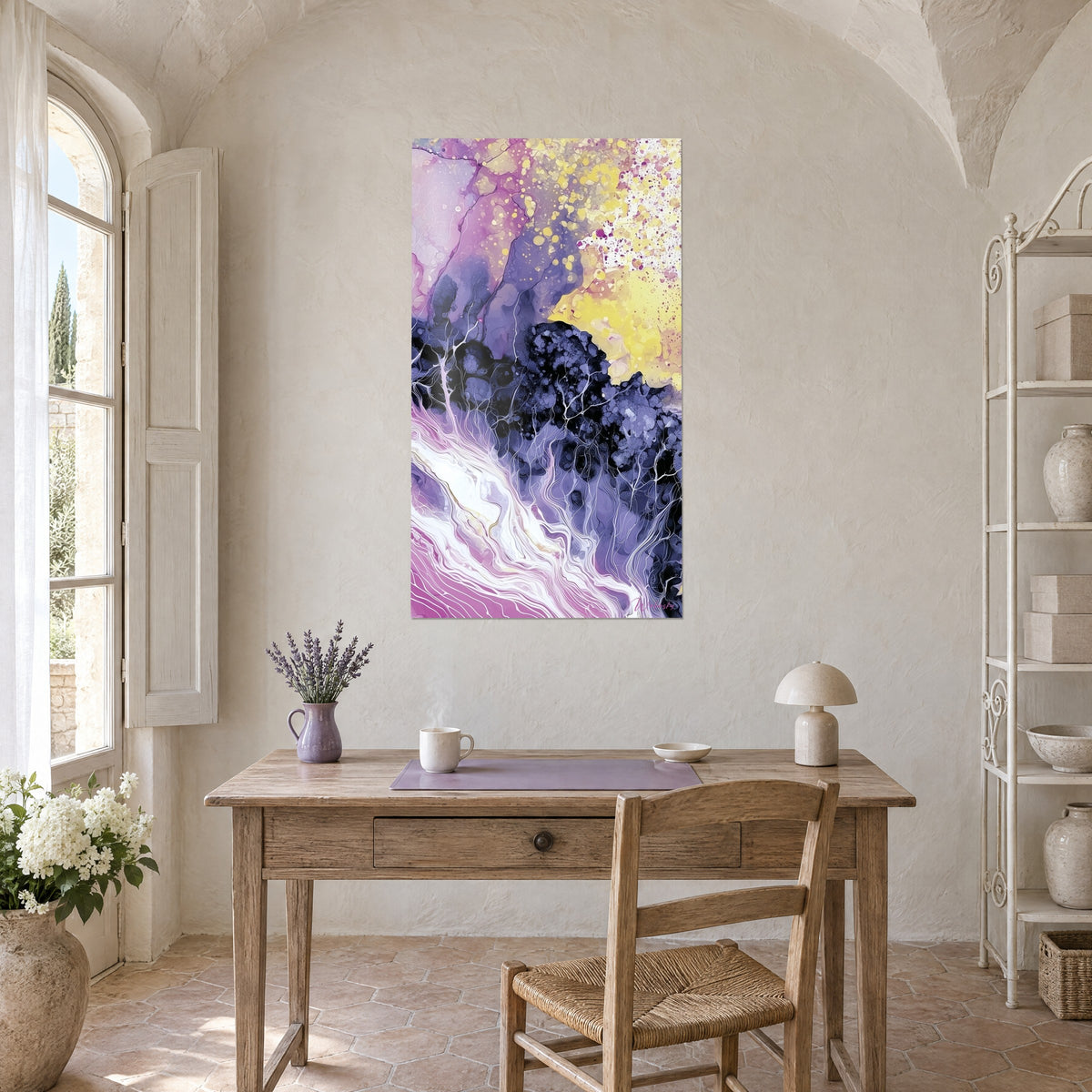 Wall art abstract landscape in black and indigo, yellow and magenta splashes, above a wooden desk beside an arched window