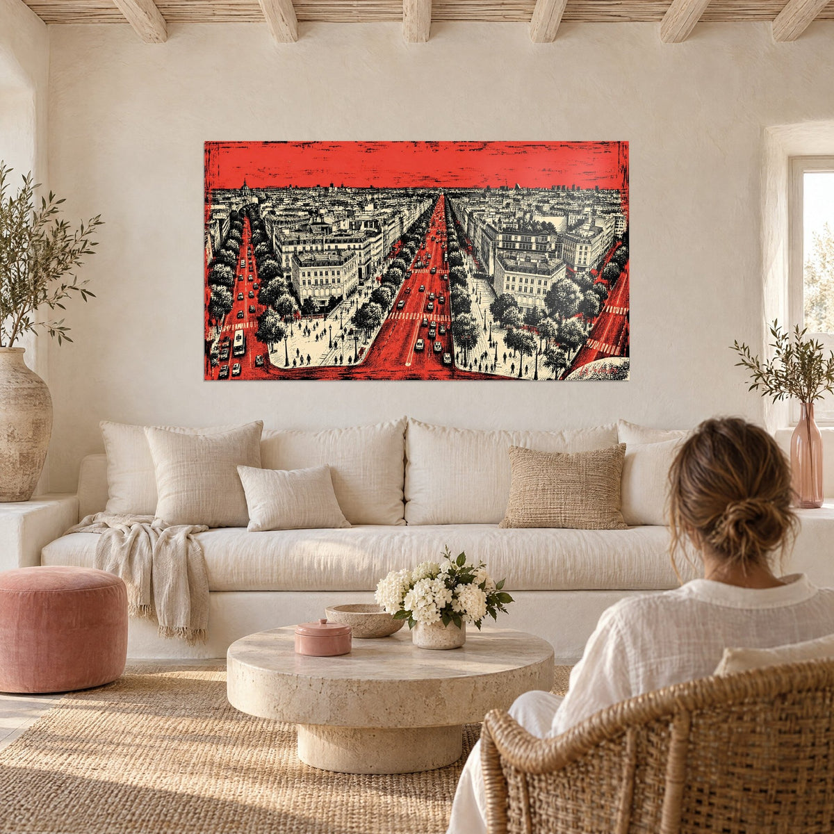 Wall art panoramic view of the Champs-Élysées in vivid red and black, engraved façades, above a sofa in a bright living room