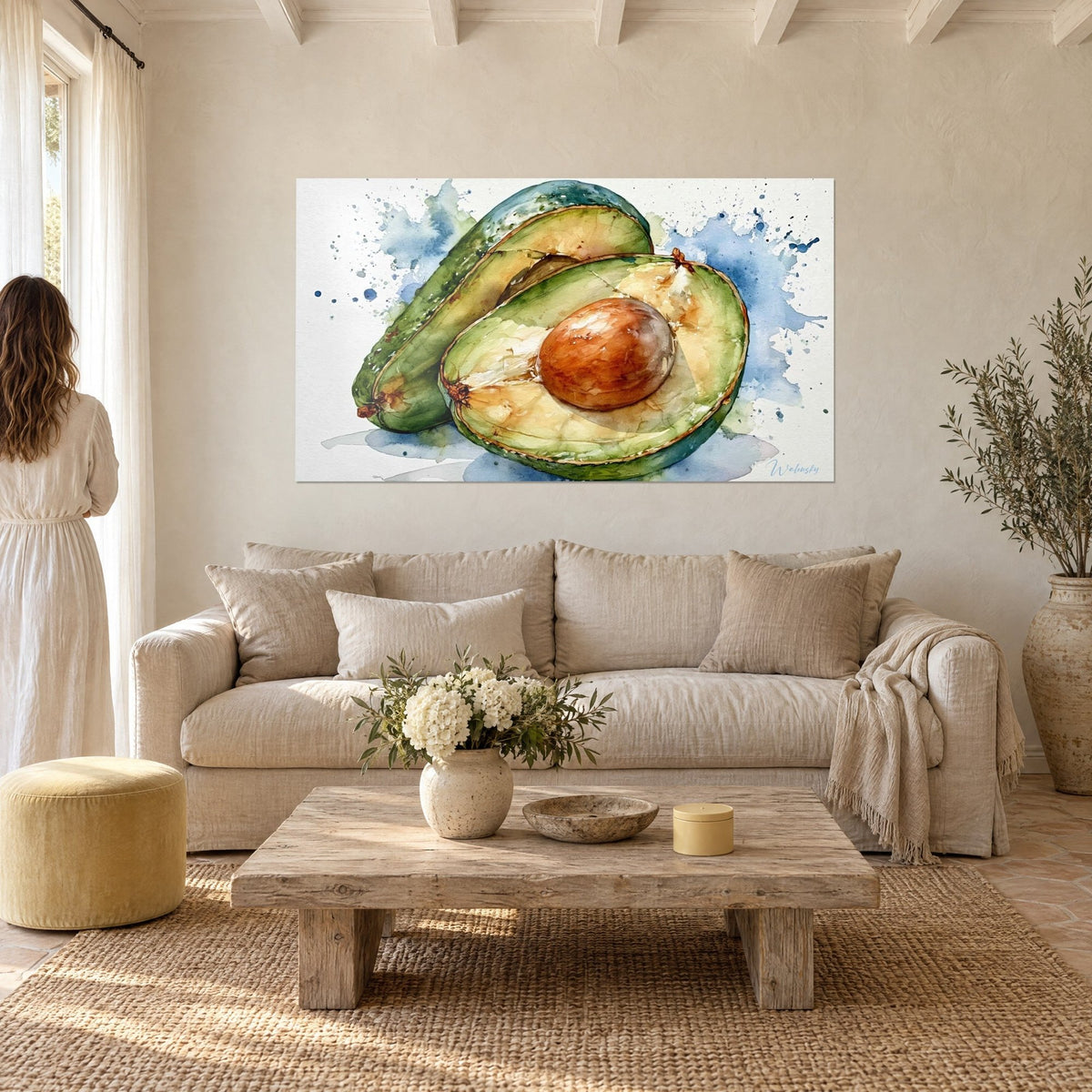 Quadro di avocado tagliato ad acquerello, polpa verde e nocciolo bruno, schizzi blu, sopra un divano in un soggiorno luminoso