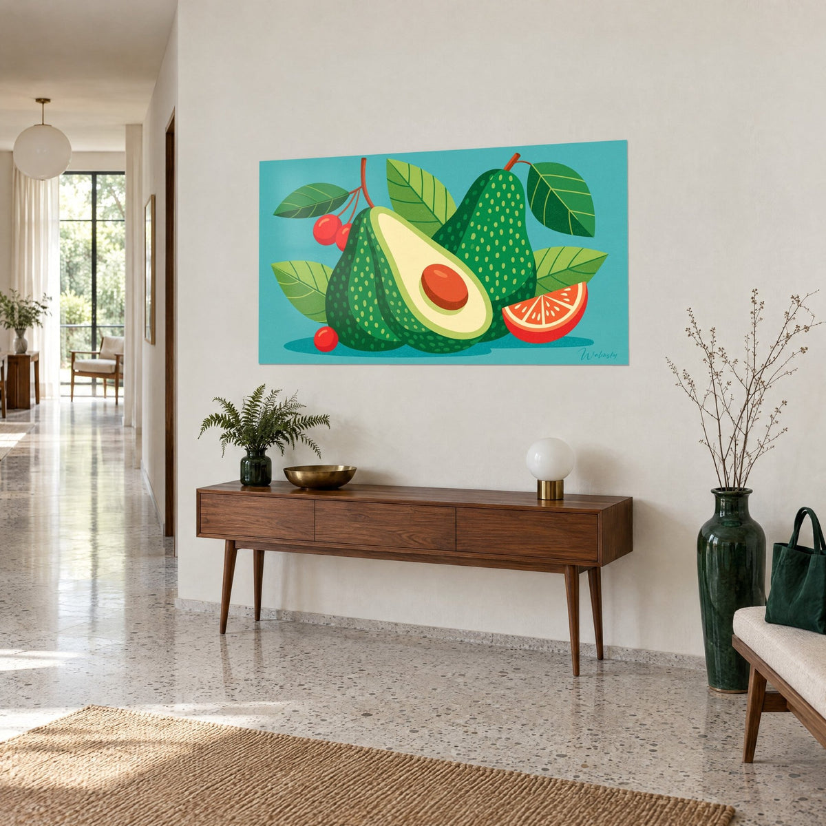 Tableau demi-fruit vert à pépin brun, quartier de pamplemousse rouge, fond turquoise, au-dessus d'une console en bois dans un couloir