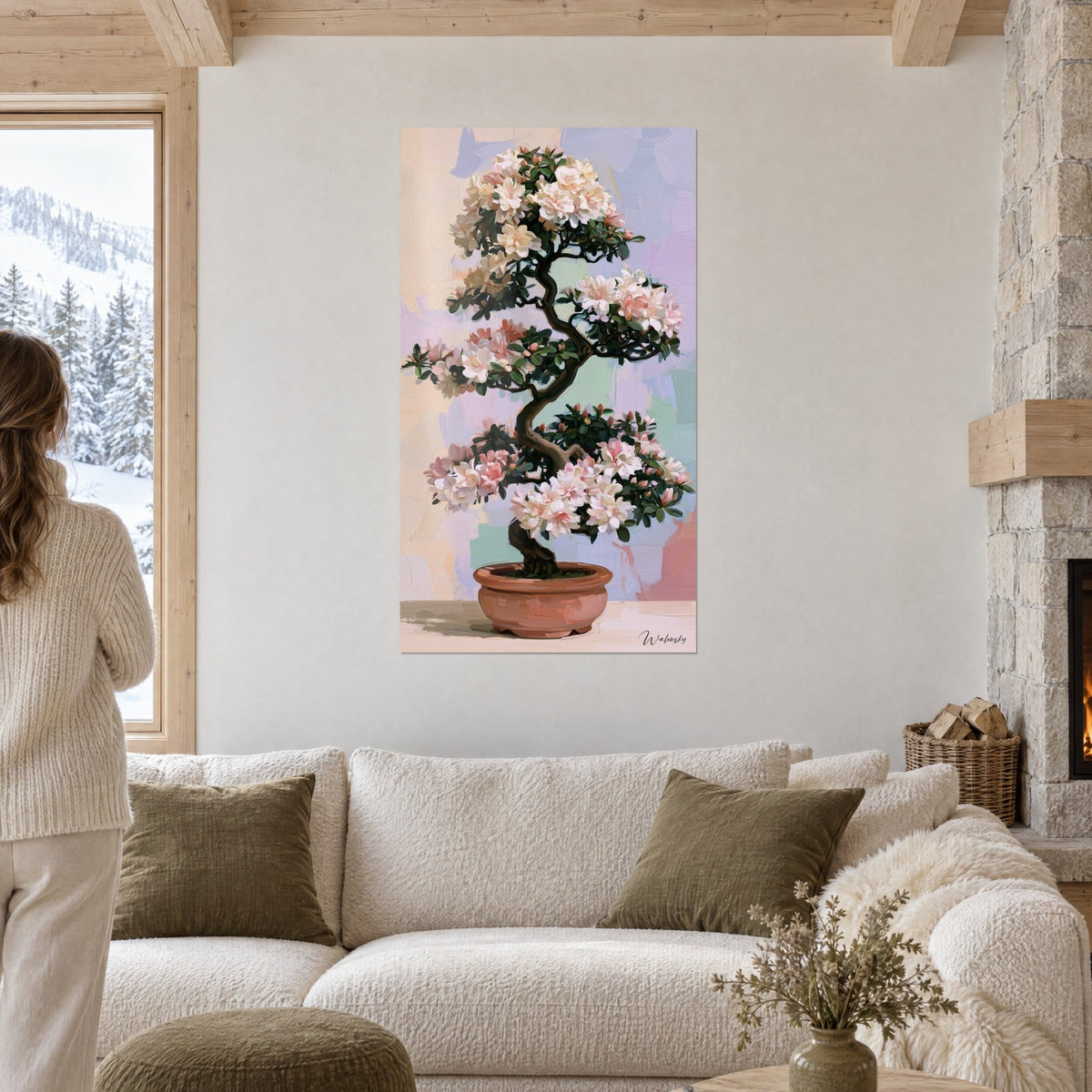 Tableau bonsaï en fleurs aux pétales blancs et roses, tronc brun sinueux, sur fond lilas, au-dessus d'un canapé dans un salon lumineux