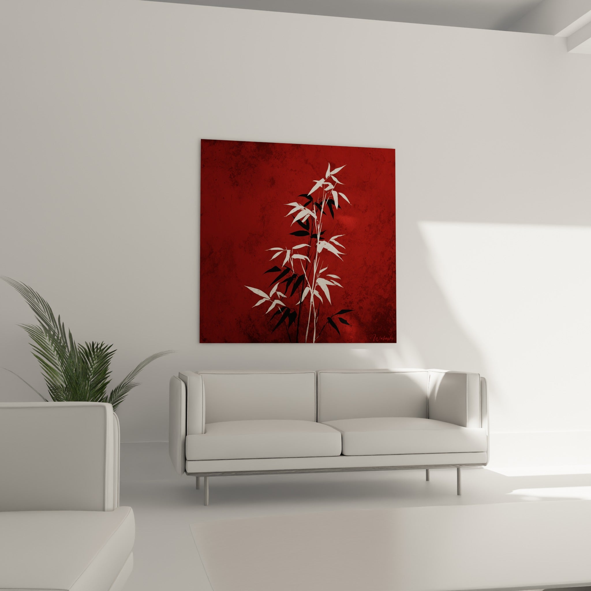 Feuillage de bambou contrasté noir et blanc sur fond rouge terracotta au-dessus d'un canapé dans un salon lumineux