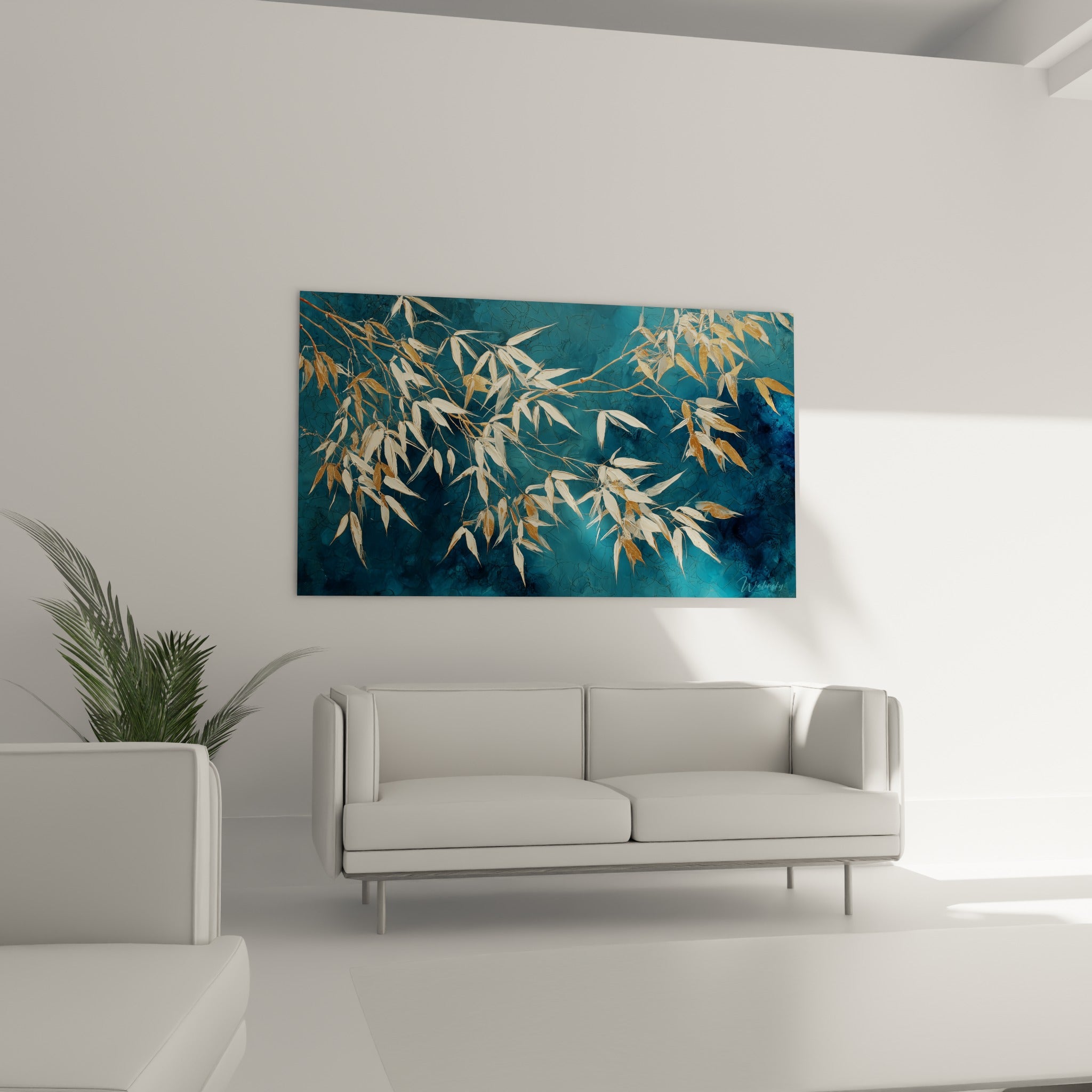 Branches dorées de bambou traversant un fond anthracite, accrochées au-dessus d'un canapé dans un salon lumineux
