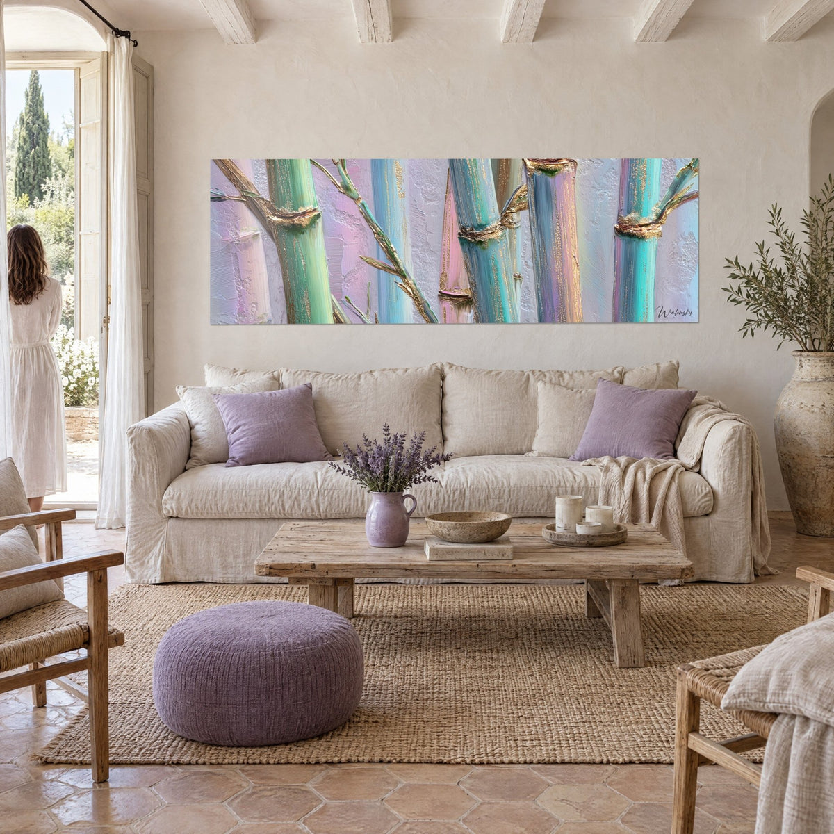 Wall art of turquoise bamboo with golden nodes on a textured mauve background, two people seen from behind, above a sofa in a bright living room