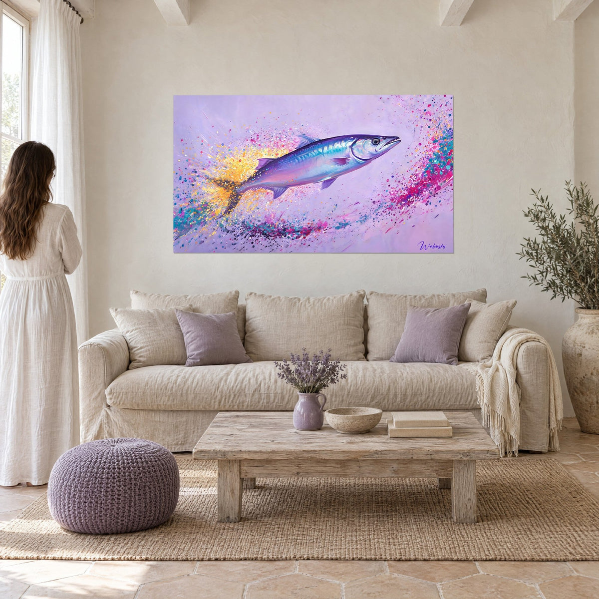 Wall art of a silver barracuda leaping, purple back and golden yellow splashes, above a sofa in a bright living room