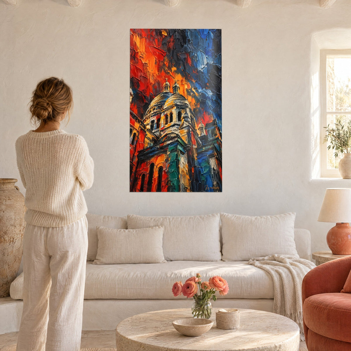 Wall art white and gold basilica under a red and blue sky, thick brushstrokes, woman seen from behind, above a sofa in a bright living room