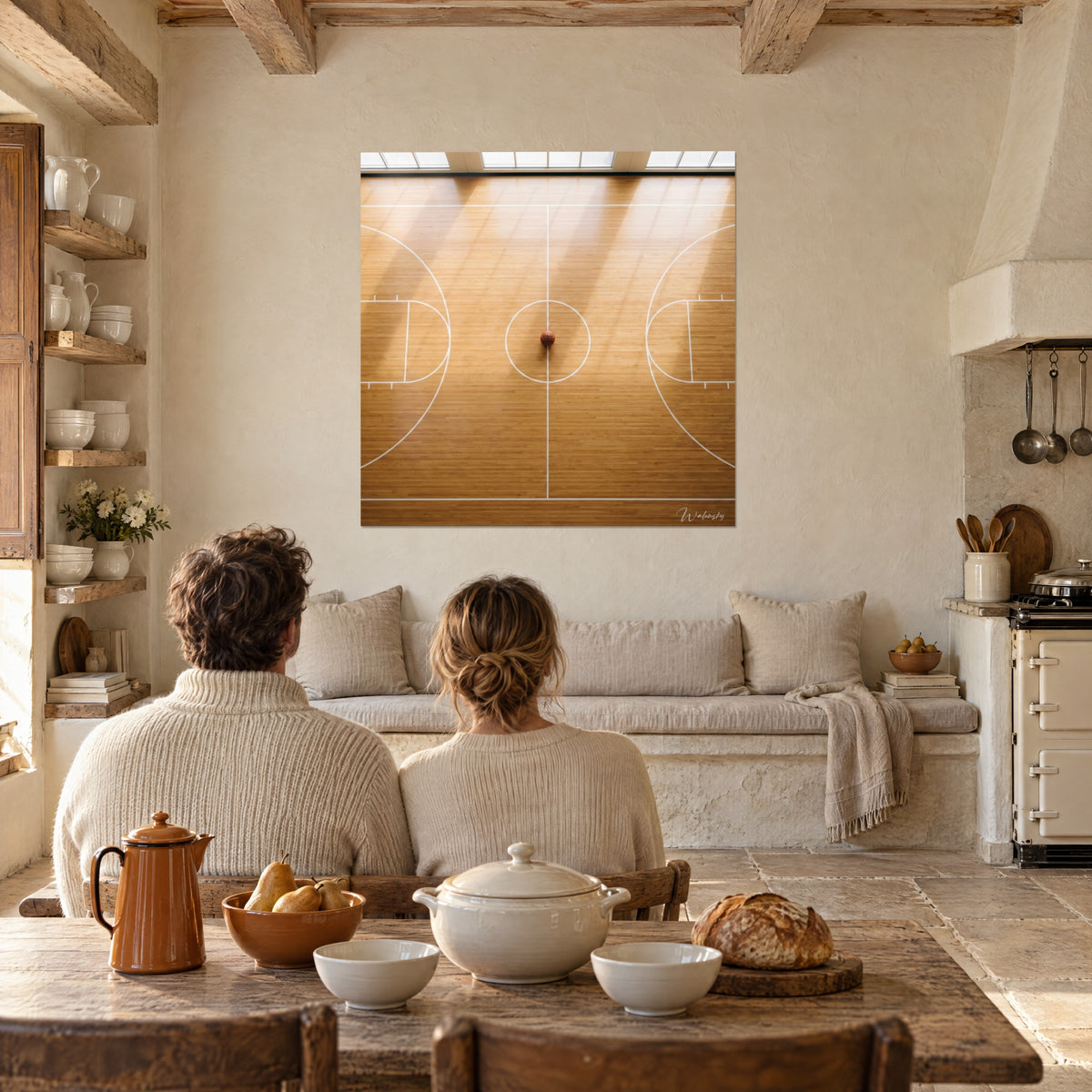 Wall art orange Wilson basketball resting on a blond floor, crisp white lines, a couple seen from behind at a table, in a stone country house