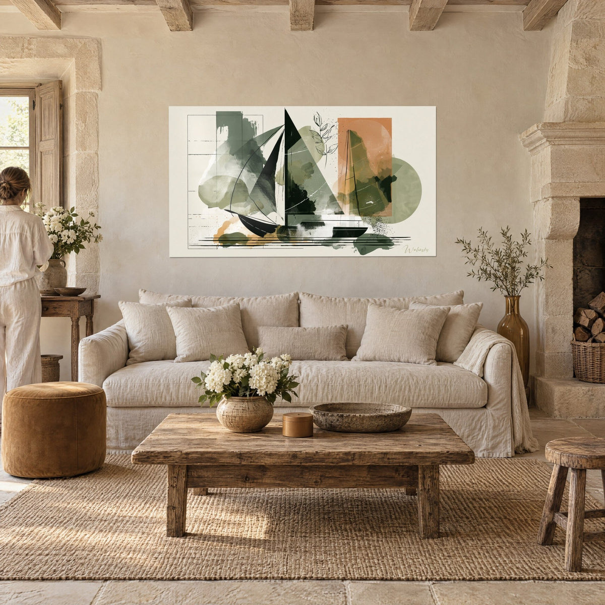 Tableau voilier abstrait aux voiles noires et vert sauge, rectangle terracotta, deux personnes de dos, au-dessus d'un canapé dans un salon lumineux