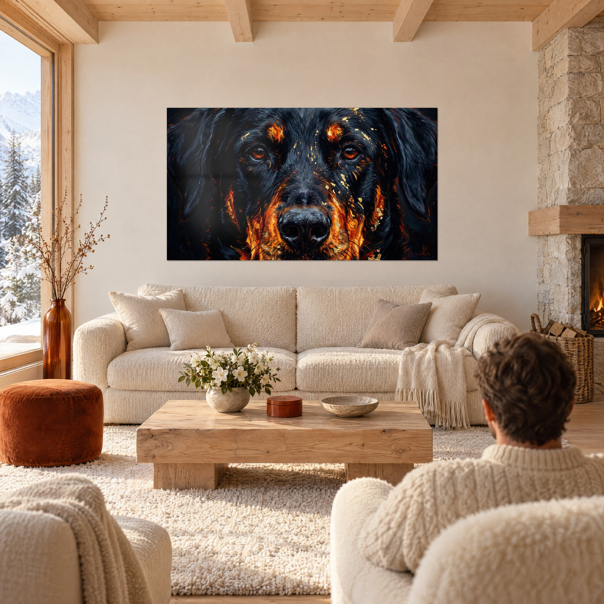 Wall art portrait of a black dog with amber eyes and gold leaf, above a sofa in a bright living room