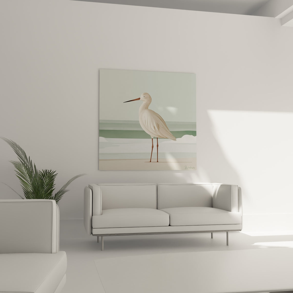 Silhouette longiligne de bécasse ocre et vert sauge au-dessus d'un canapé dans un salon lumineux
