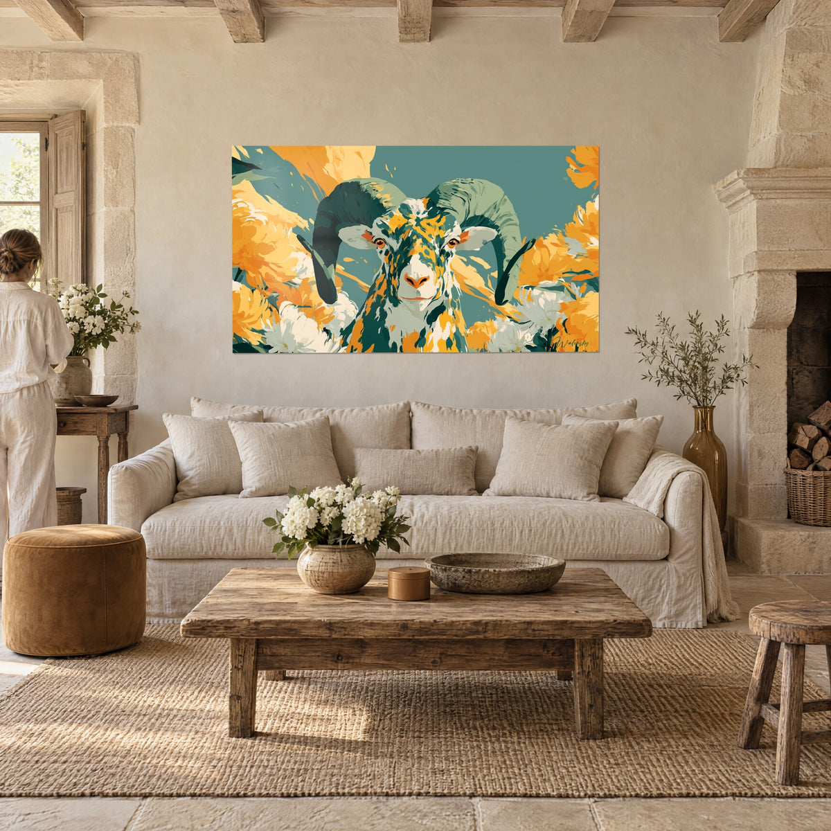 Wall art ram with teal green horns surrounded by orange and white chrysanthemums, above a sofa in a bright living room