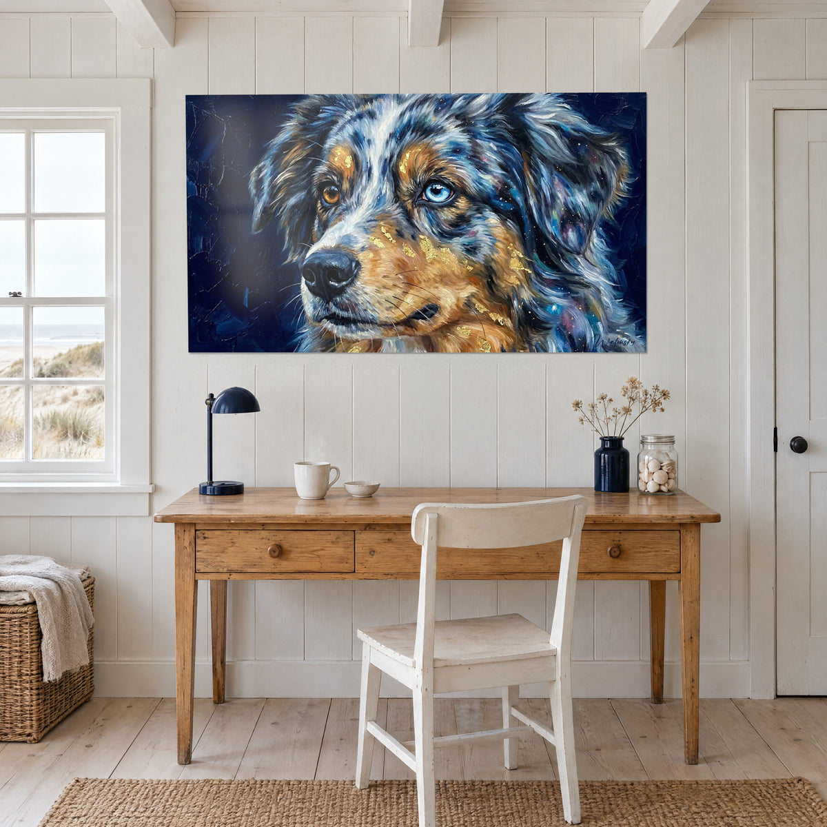 Wall art head of a tricolor dog, black nose and golden touches, hung above a light wood desk and a white chair