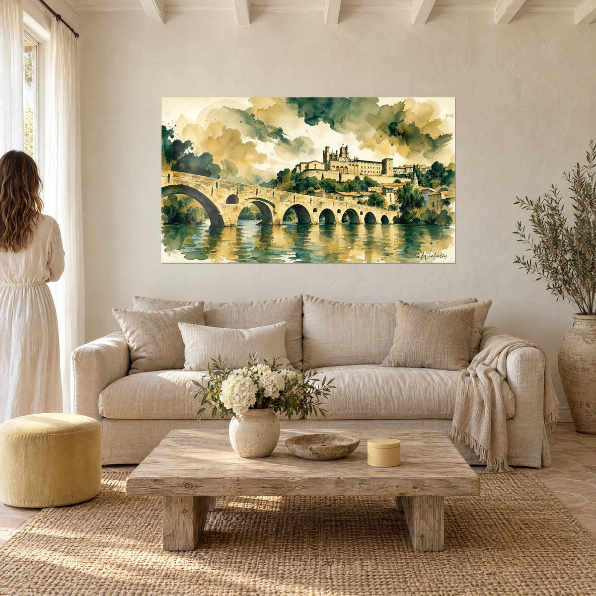 Wall art Pont Vieux with its seven golden ochre arches, cathedral overlooking the river and sage green sky, above a sofa in a bright living room