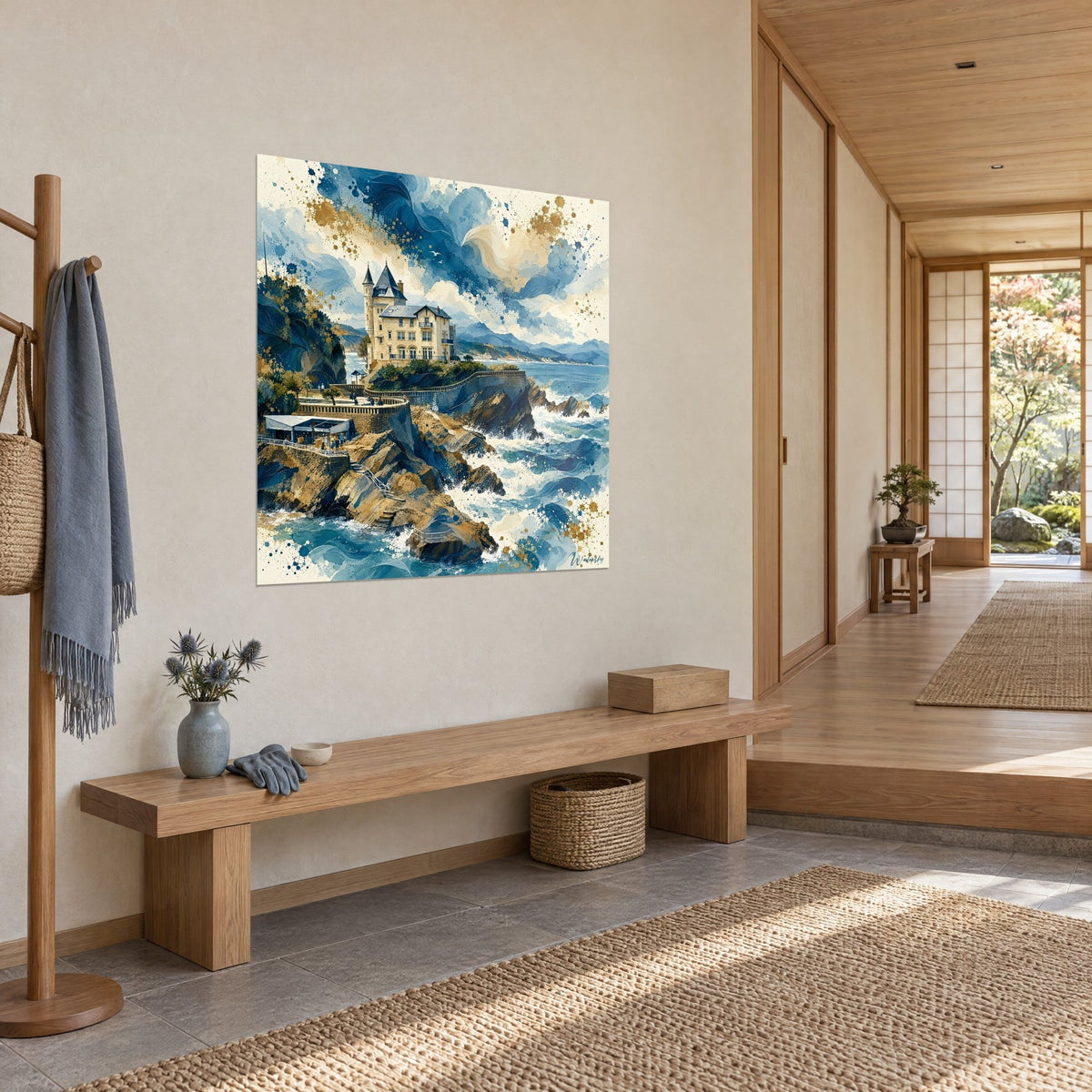 Wall art cream castle overlooking the ocean, ochre rocks, white foam and indigo sky, hung in a light wood hallway