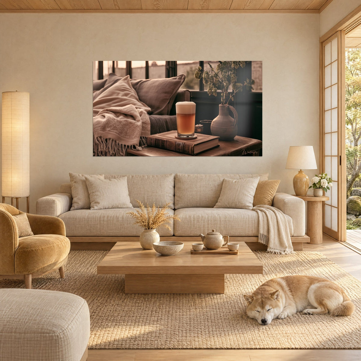 Wall art of a beer mug with frothy amber ale on a brown leather book, beige pitcher and hops, a shiba lying down, above a sofa in a bright living room