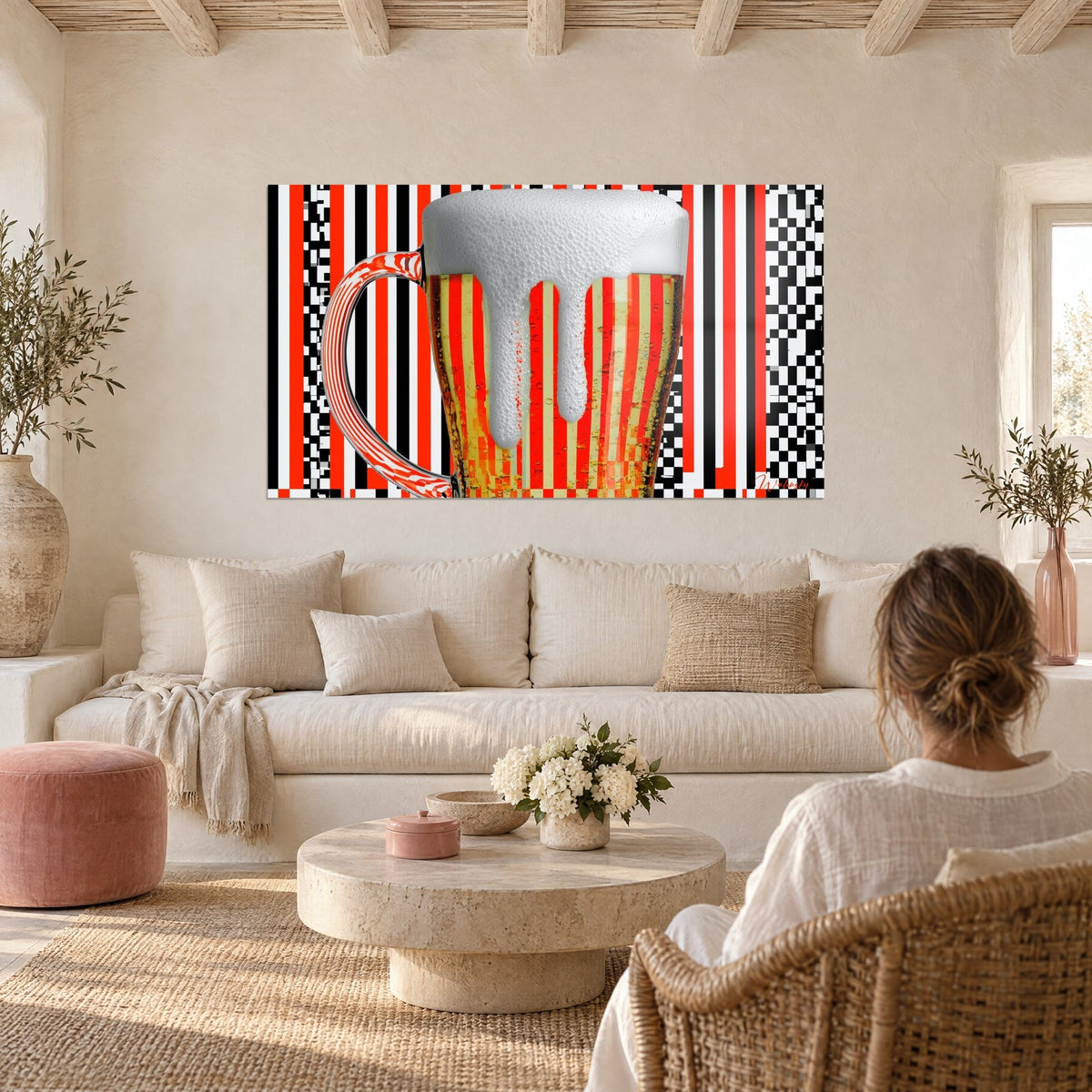 Wall art Beer mug with overflowing white foam, red and black stripes, above a sofa in a bright living room