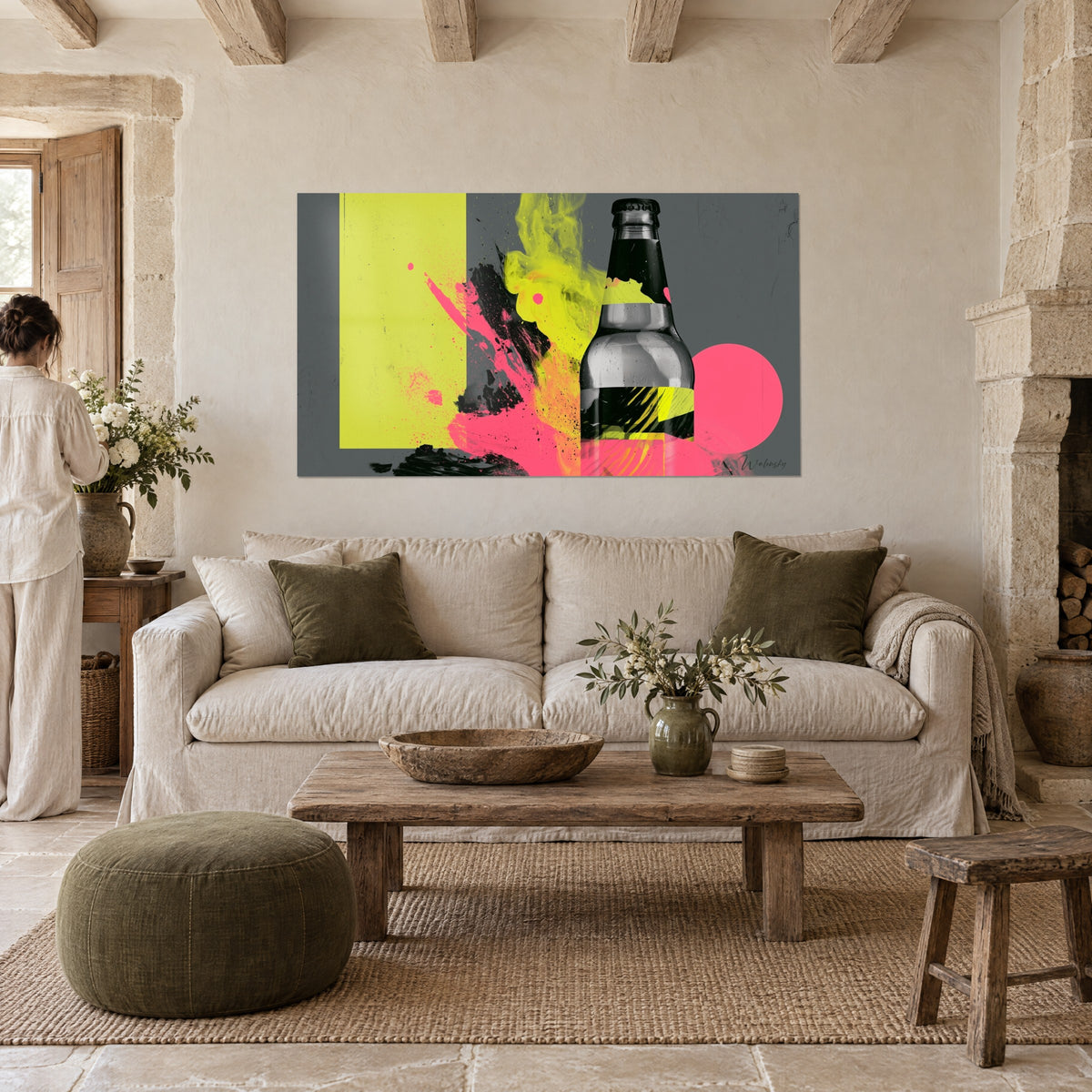 Wall art grey beer bottle splashed with neon yellow and pink, giant pink circle above a sofa in a bright living room