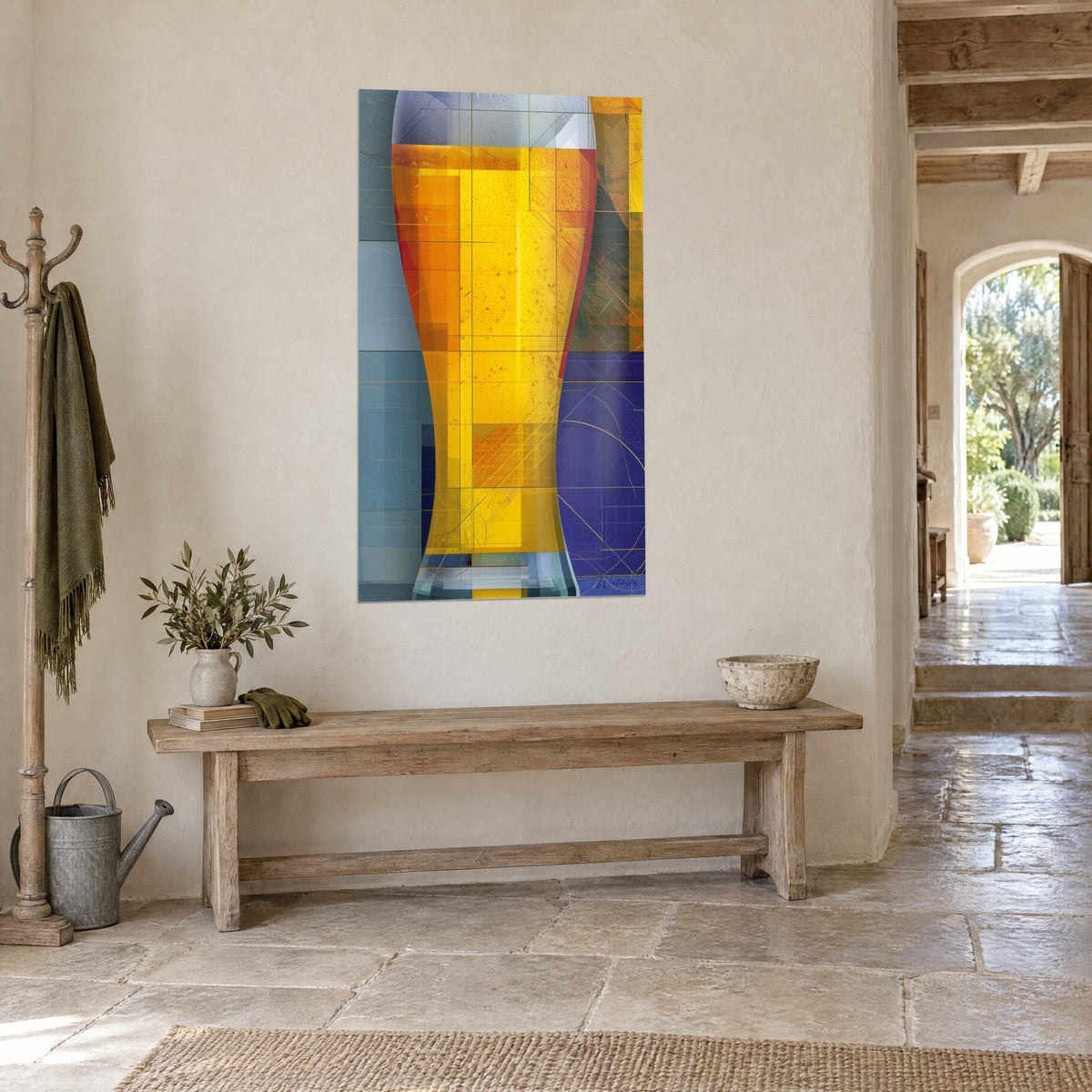 Wall art frothy beer glass with petrol blue and honey yellow geometric blocks, hung at an angle in a stone hallway