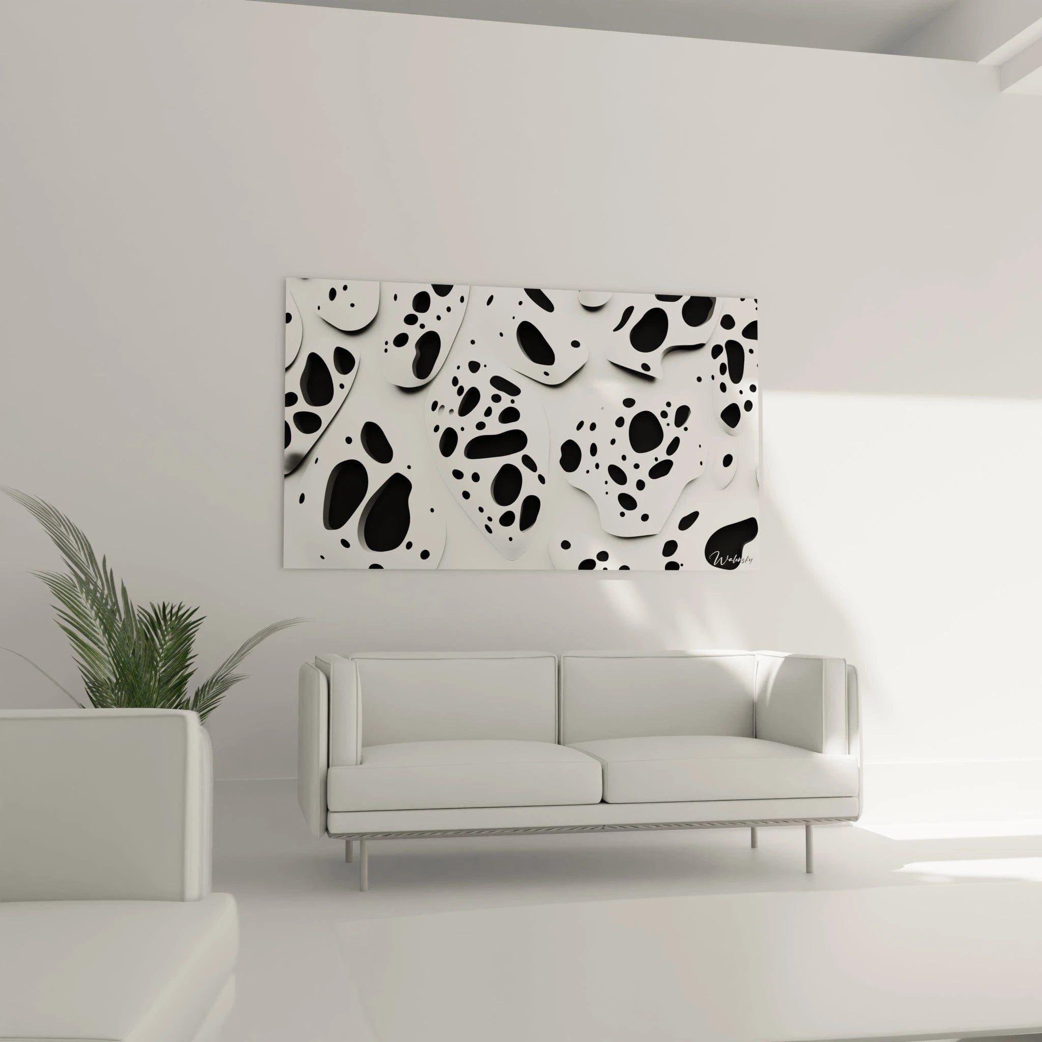 Tableau tacheté noir et blanc Walensky décorant un salon moderne avec un canapé blanc