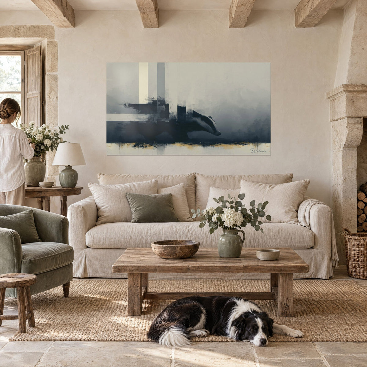 Wall art of an anthracite badger with beige stripes in grey mist, reclining collie, above a sofa in a bright living room