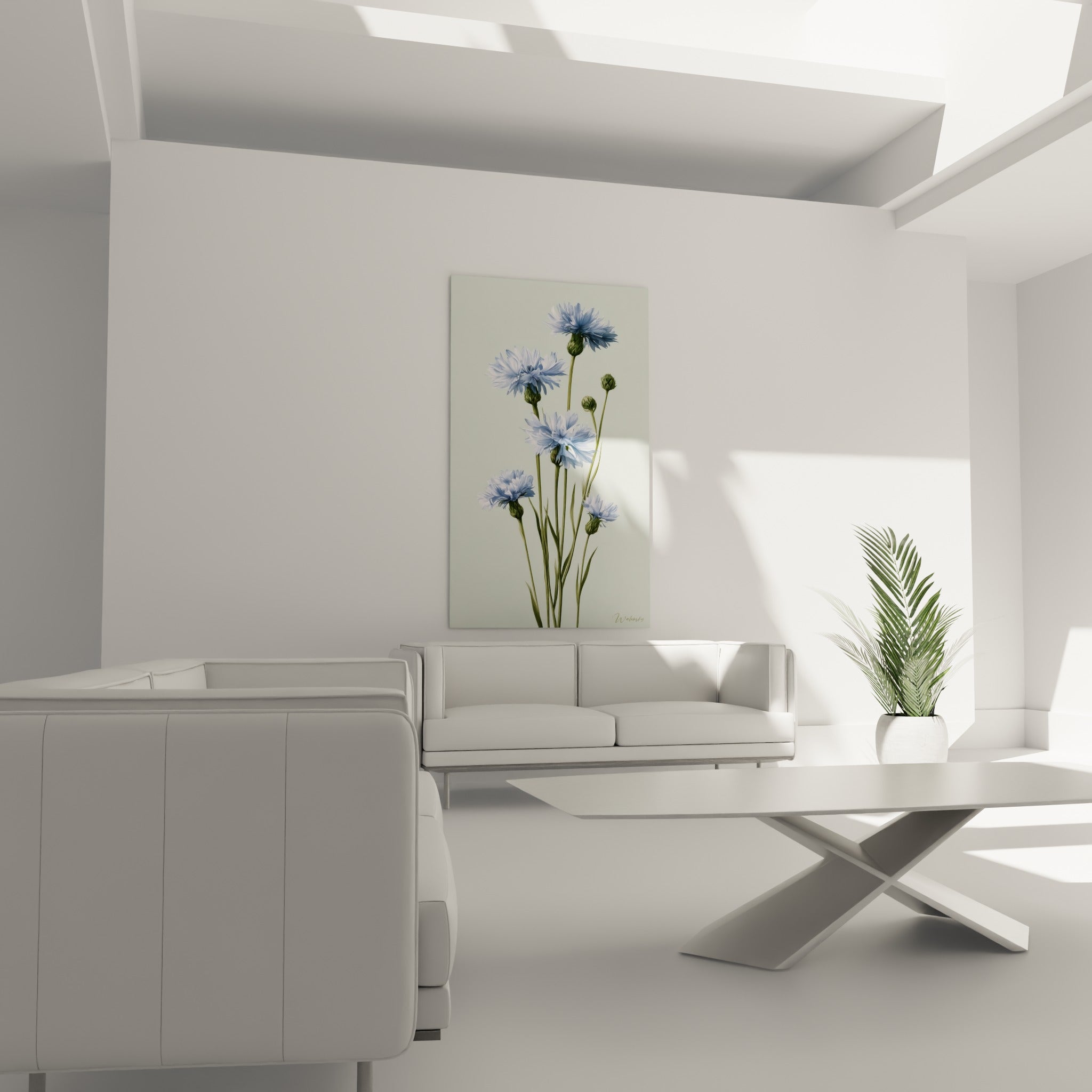Fleurs de bleuet bleu ciel sur fond vert sauge disposées au-dessus d'un canapé dans un salon lumineux
