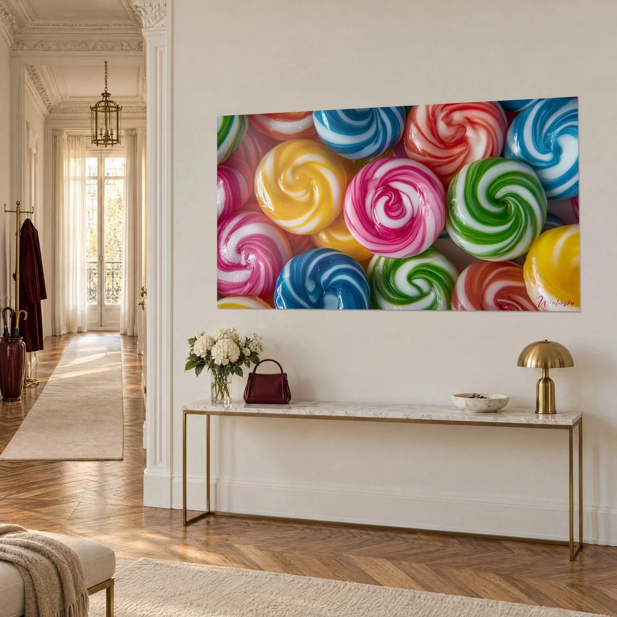 Wall art swirling candies in cobalt blue and white, red and green spirals, above a gilded Haussmann console