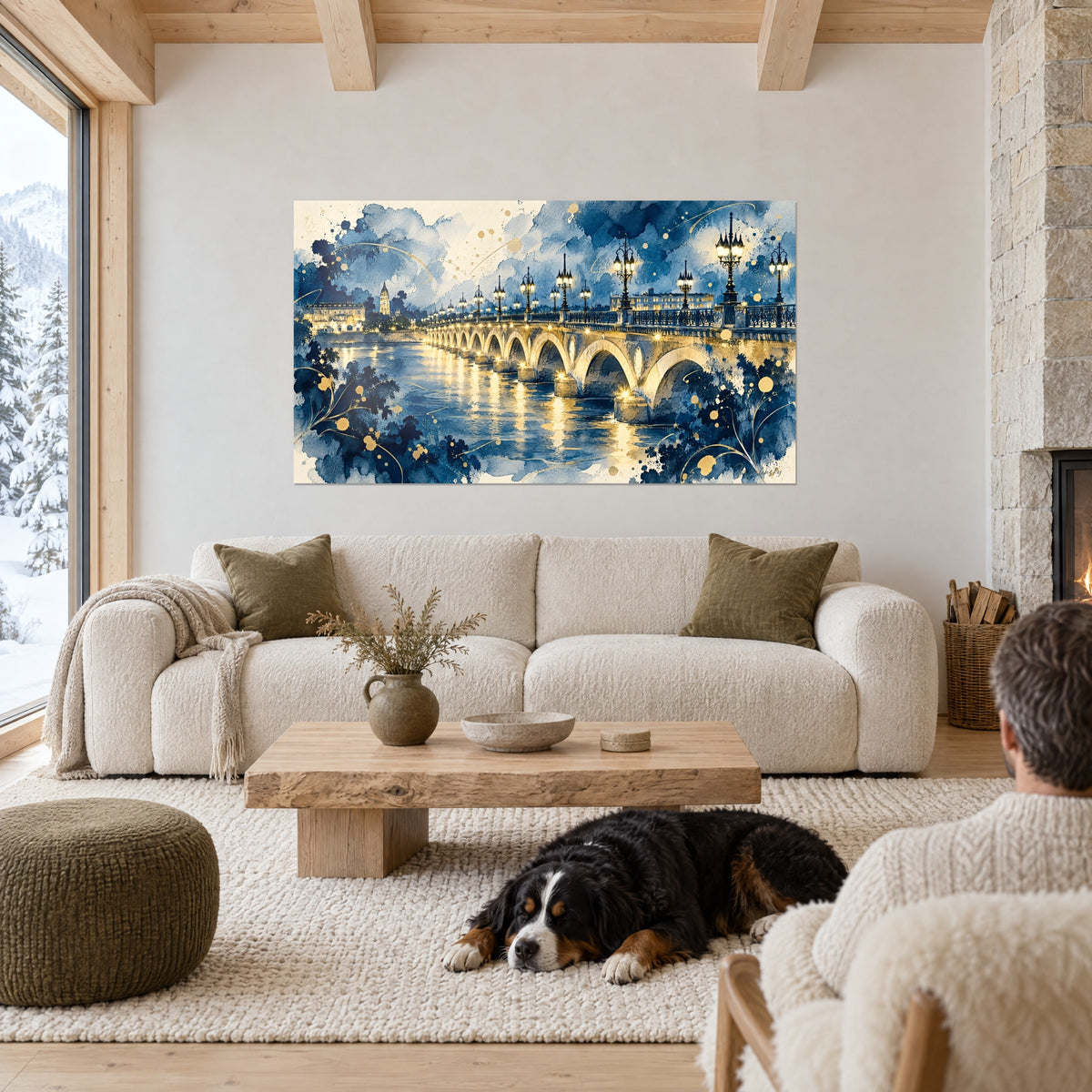 Quadro ponte di pietra illuminato da lampioni dorati su un fiume blu notte, cane nero sdraiato, sopra un divano in un soggiorno luminoso