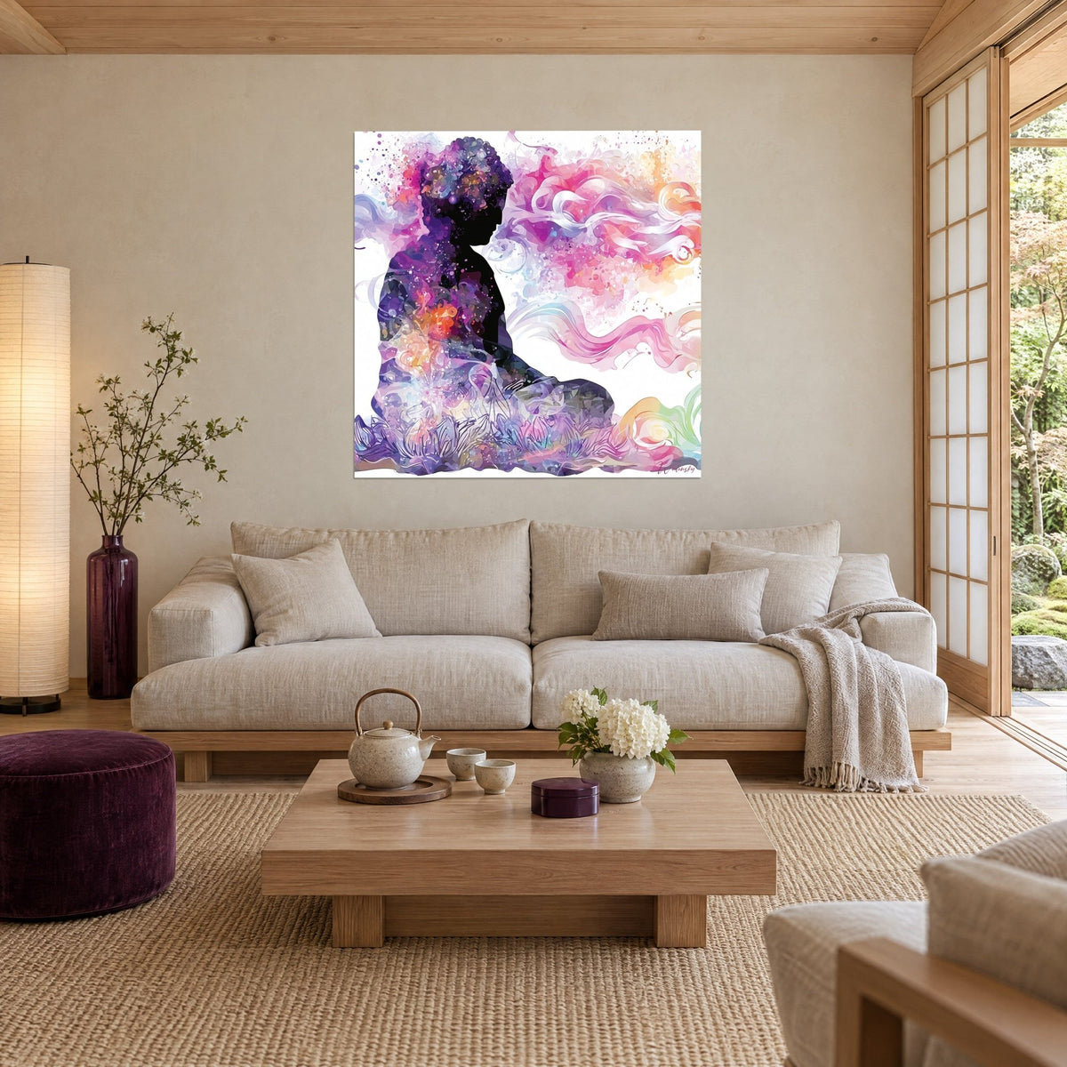 Tableau silhouette de Bouddha assis, volutes roses et violettes sur fond blanc, éclats orangés, au-dessus d'un canapé dans un salon lumineux