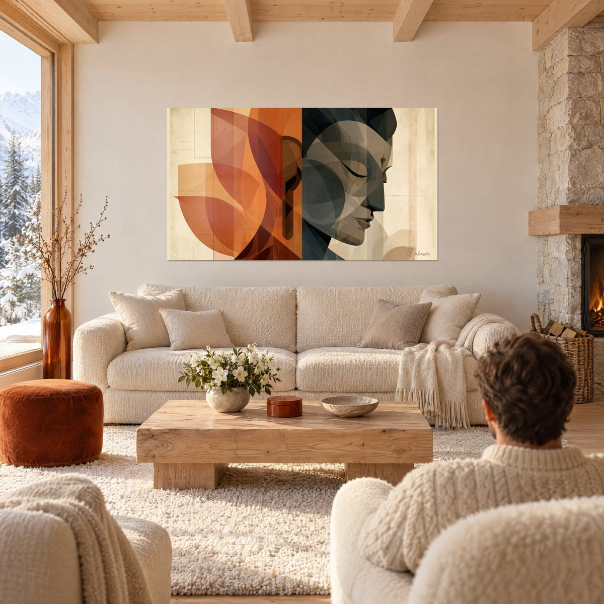Tableau visage de Bouddha anthracite aux paupières closes, pétales terracotta et crème, dans un chalet, au-dessus d'un canapé dans un salon lumineux
