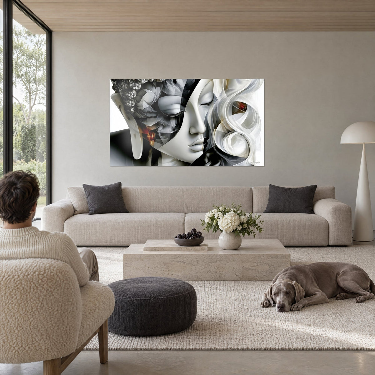 Tableau visage de Bouddha serein aux paupières closes, blanc nacré et anthracite, volutes soyeuses, au-dessus d'un canapé dans un salon lumineux
