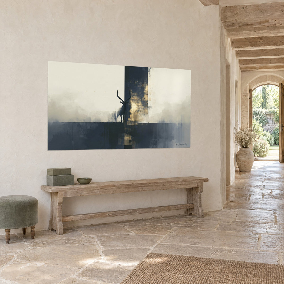 Wall art black horned antelope facing a patinated gold band, cream and midnight blue background, on a stone wall beside a wooden bench