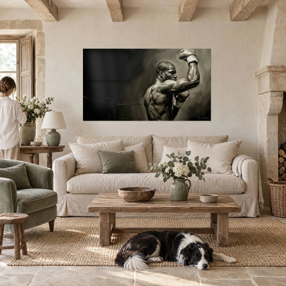 Wall art of a boxer in sepia raising his white glove, muscular back gleaming against black and brown, above a sofa in a bright living room