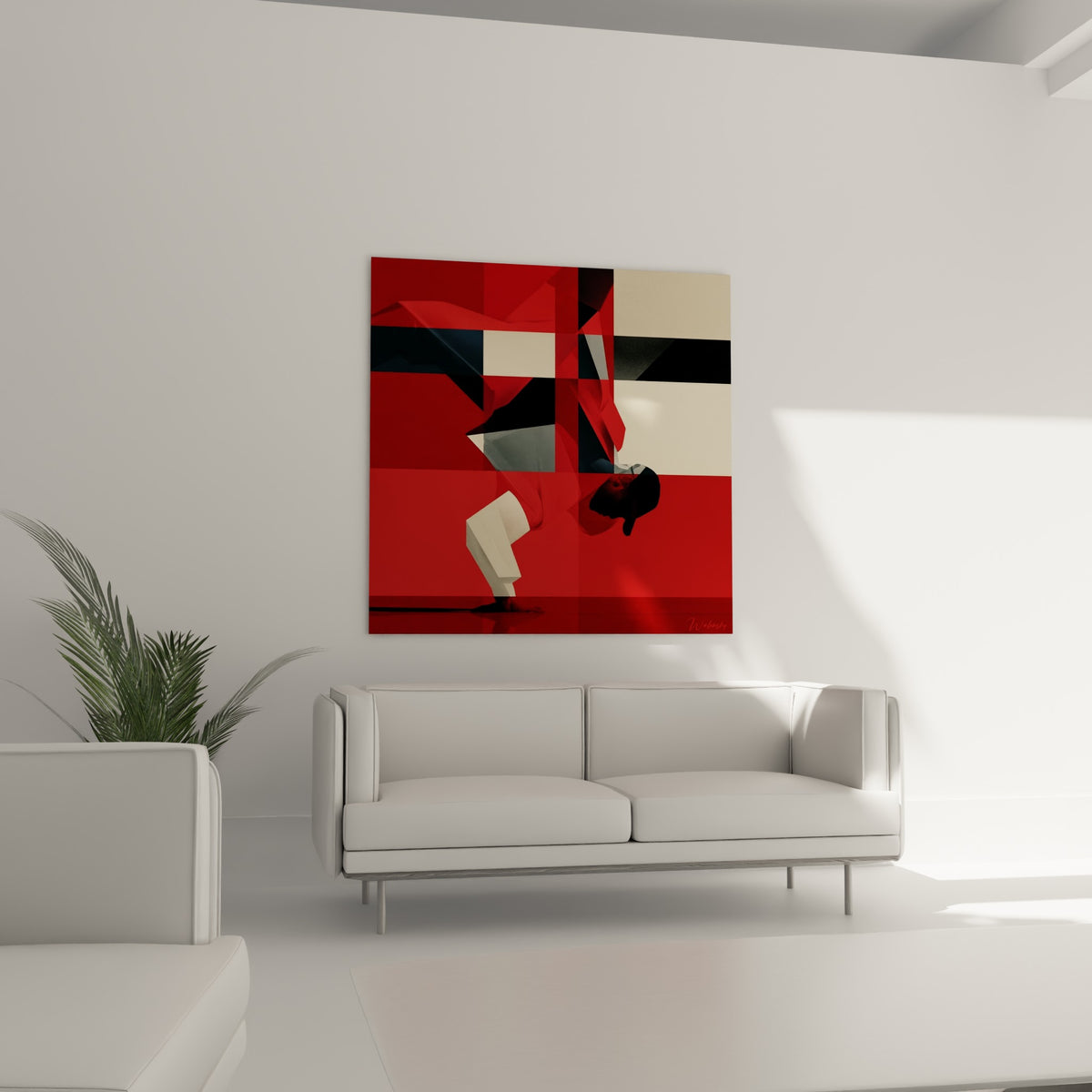 Corps du danseur incliné vers le sol, tons rouge et crème contrastés, au-dessus d'un canapé dans un salon lumineux