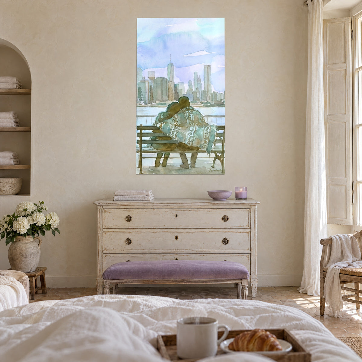 Wall art of a couple snuggled under a patterned blanket in front of Manhattan, sky blue and brown ochre, woman seen from behind, above a bed in a bright bedroom
