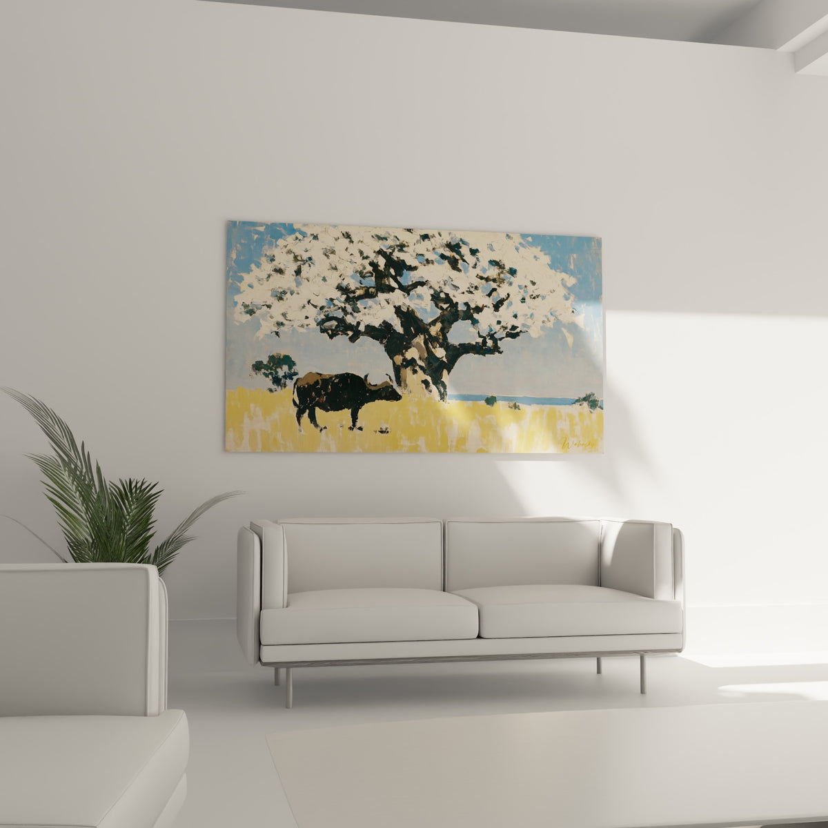 Animal noir face à un arbre fleuri bleu et blanc, œuvre suspendue au-dessus d'un canapé dans un salon lumineux
