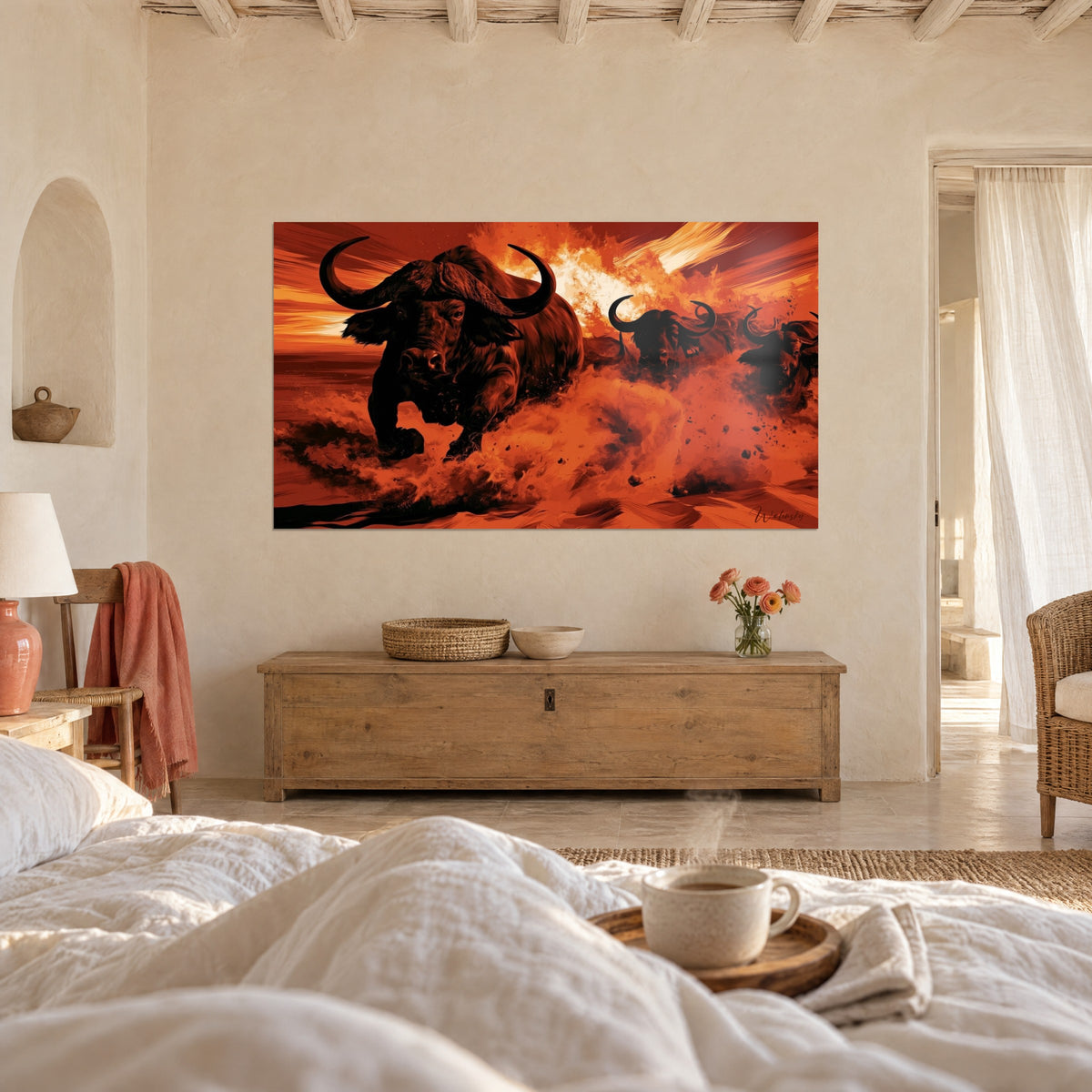 Wall art wild cattle galloping, black silhouettes against a blazing red background, above a bed in a light bedroom