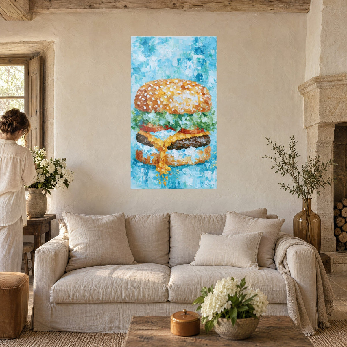 Wall art golden cheeseburger with white sesame seeds, green lettuce and melted orange cheese, above a sofa in a bright living room