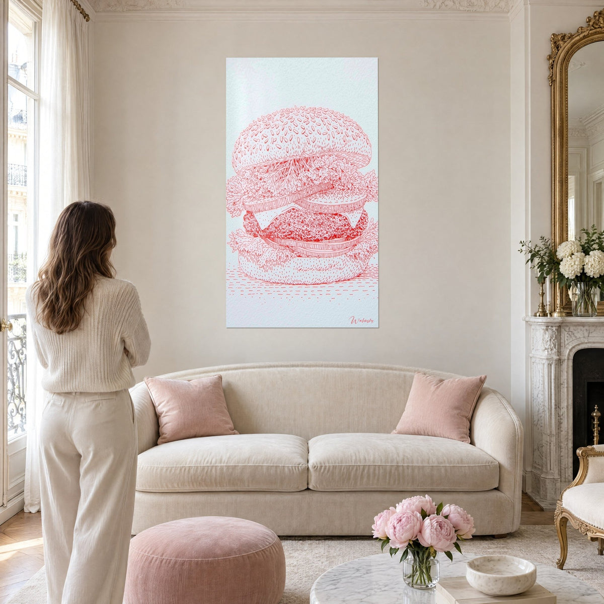 Tableau hamburger gravé au trait rouge vif sur fond blanc, pain aux graines de sésame, au-dessus d'un canapé dans un salon lumineux