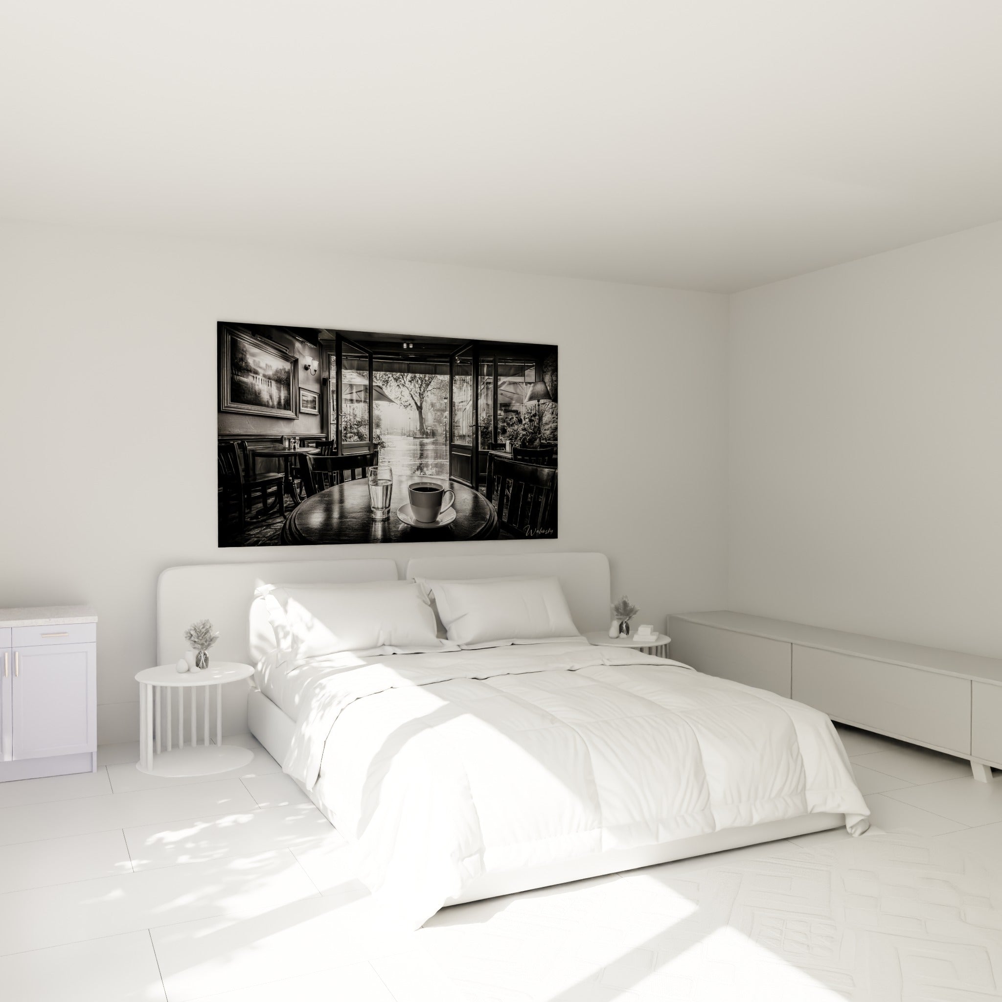 Bistrot en tons gris et blanc, tasse de café au premier plan, au-dessus d'un lit dans une chambre claire