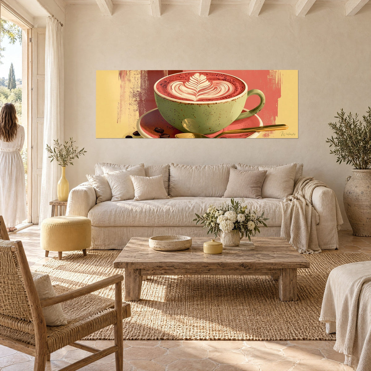 Tableau tasse verte sauge à mousse en plume crème sur fond rose corail, au-dessus d'un canapé dans un salon lumineux