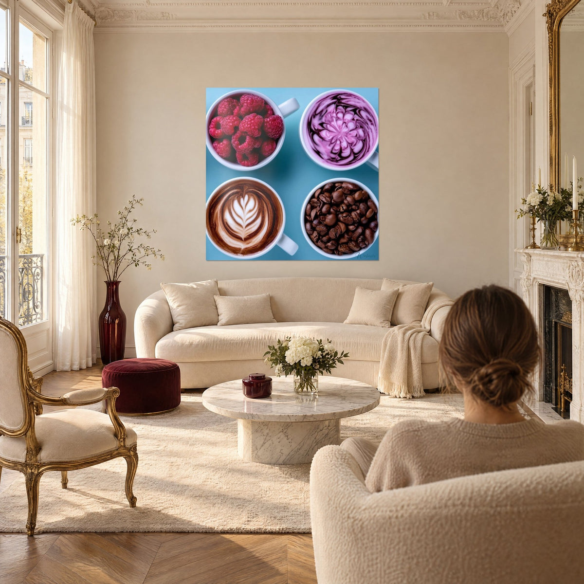 Wall art four white coffee cups seen from above, red raspberries and brown coffee beans on a blue background, above a sofa in a bright living room