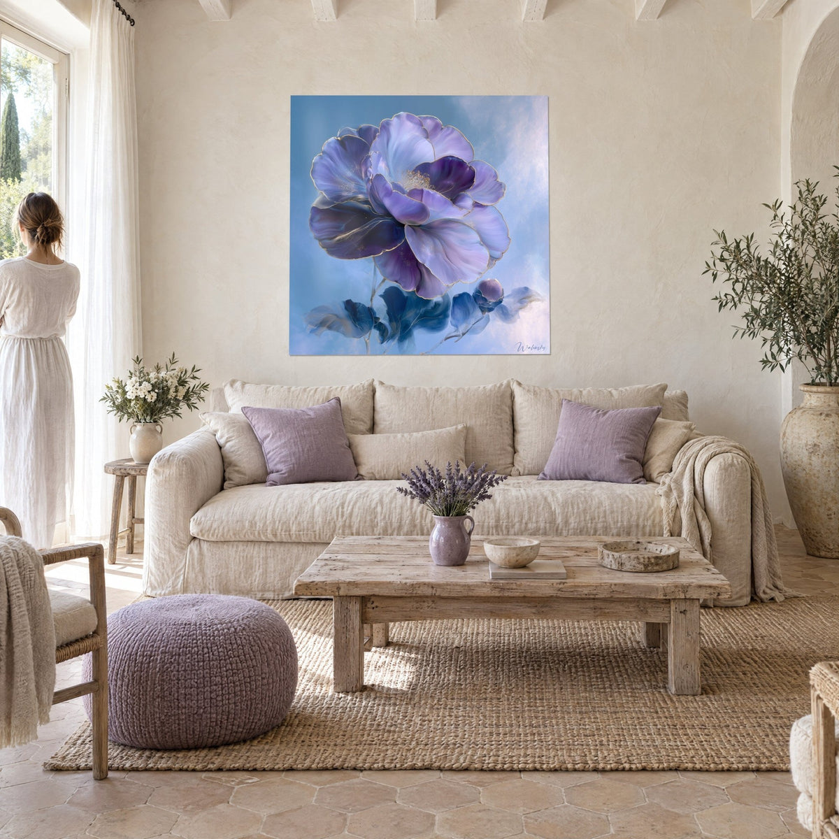 Wall art Giant camellia in mauve and midnight blue with gold edging, a woman seen from behind, above a sofa in a bright living room